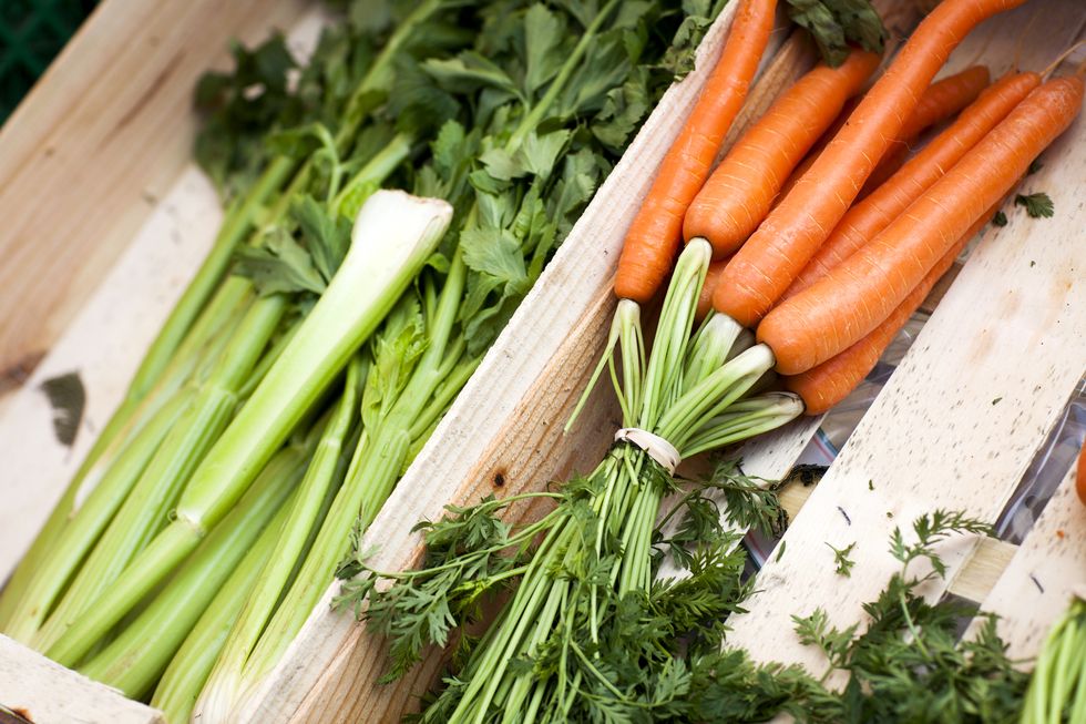 crate of fresh carrots and celery at local french market