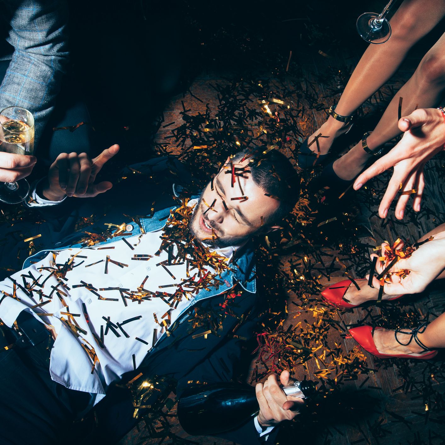 Crazy party. Drunk man lying on floor