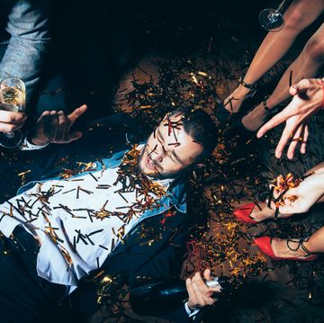 Crazy party. Drunk man lying on floor