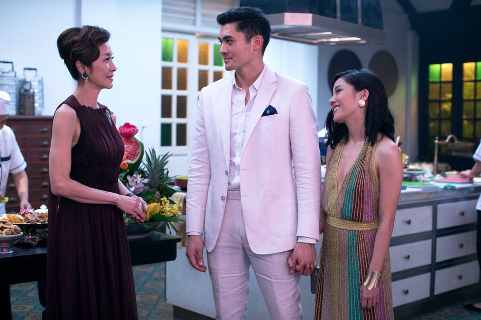 scene in crazy rich asians where is wearing a rainbow dress to meet the young family