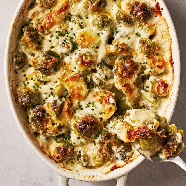 Creamed Brussels Sprouts cheesy, bubbling creamed brussels sprouts in a white oval casserole dish