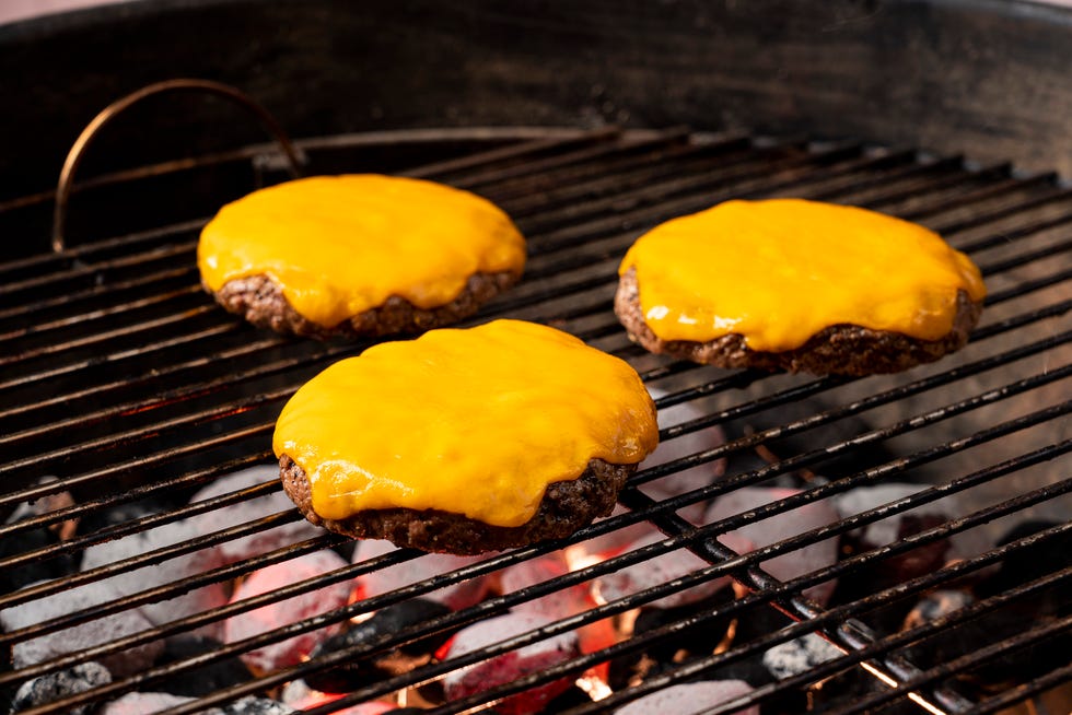 cheeseburgers on grill