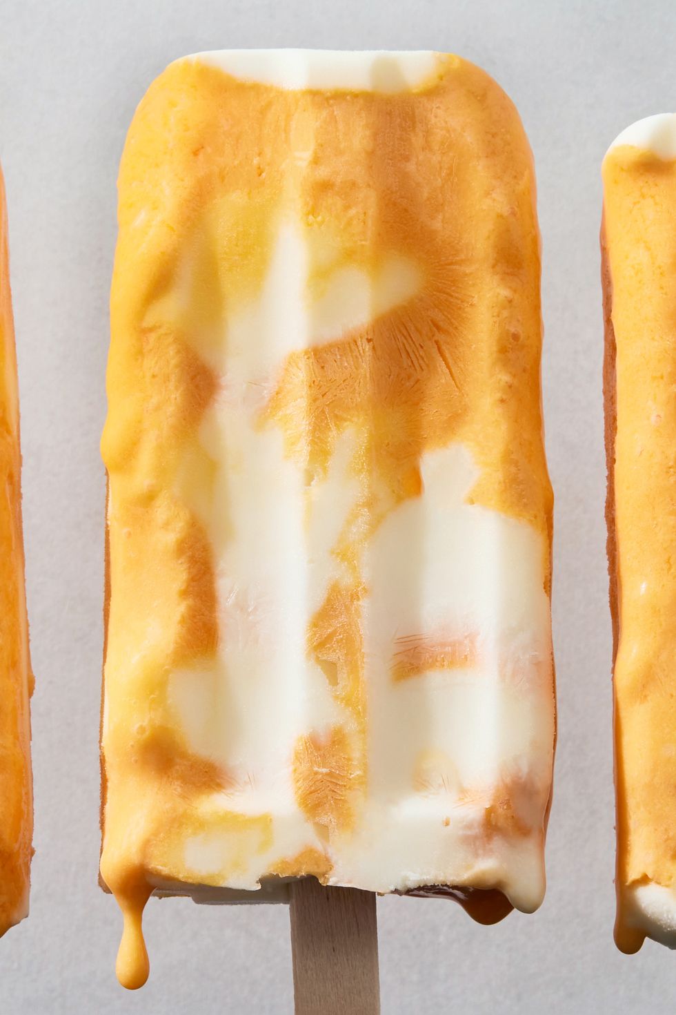 frozen creamsicle bars with orange and cream swirls