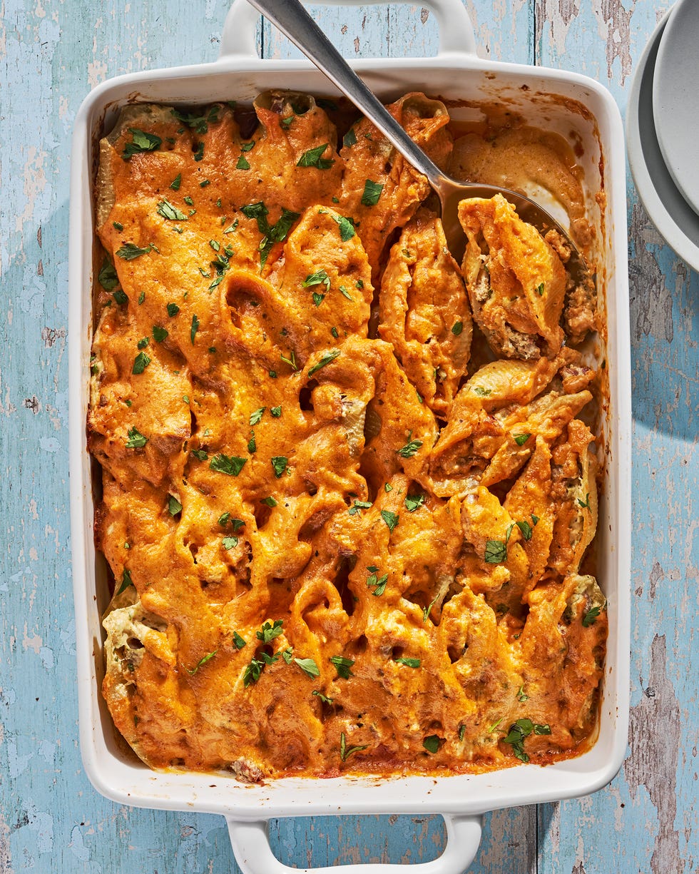 creamy cajun stuffed shells in a white baking dish