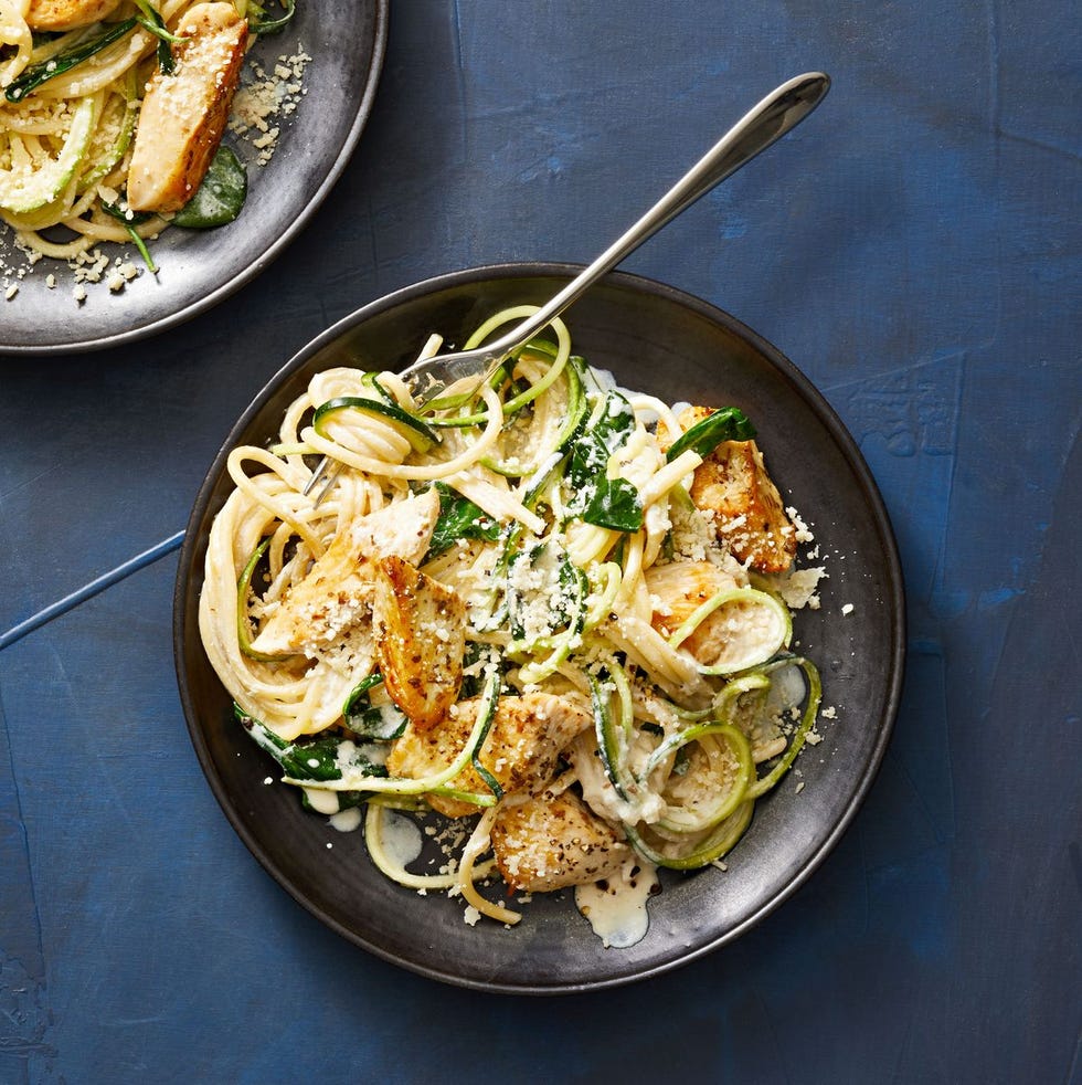 creamy chicken and zoodle spaghetti on a black plate