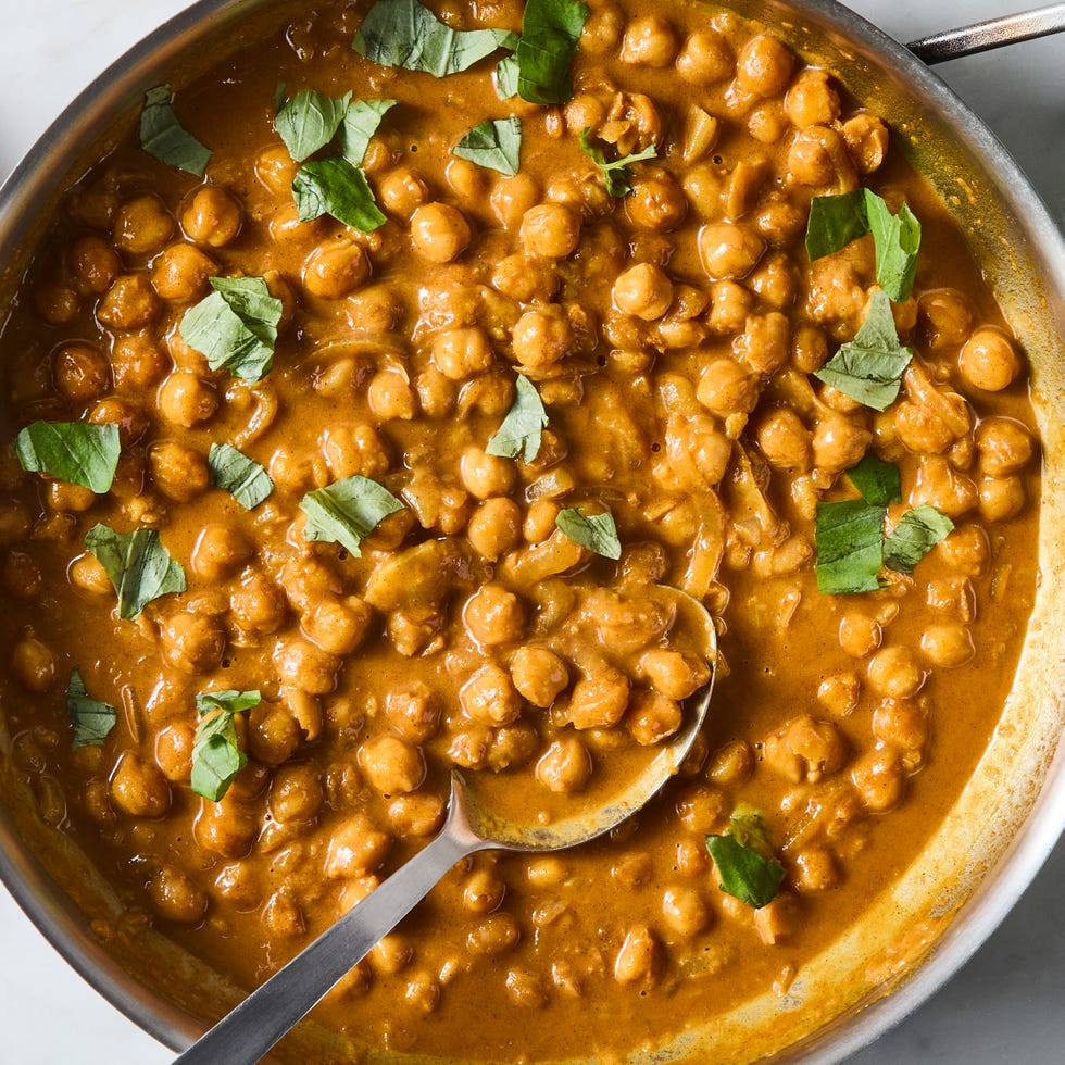 chickpeas in a creamy coconut lime sauce in a skillet