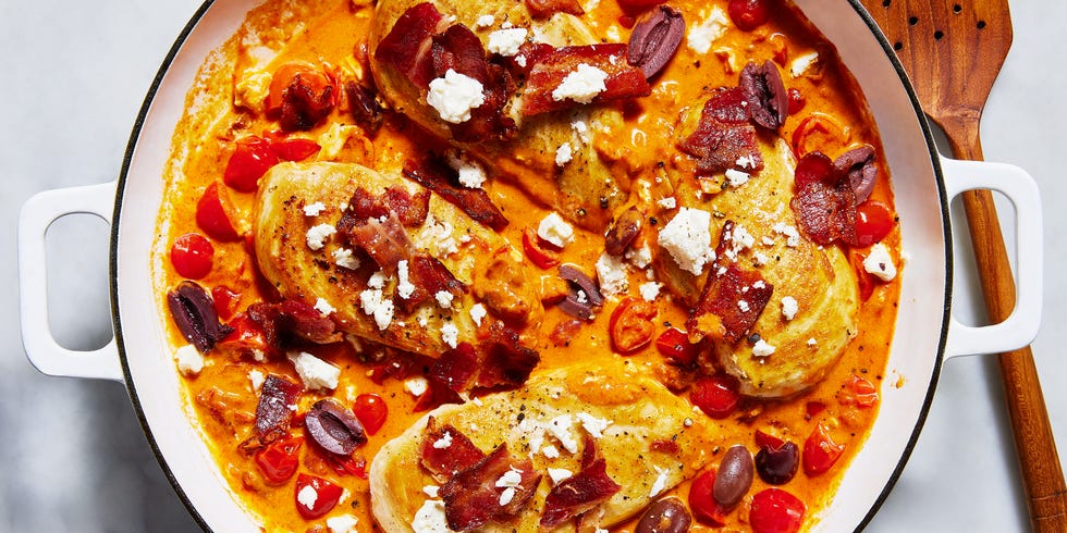 chicken breasts in a creamy sauce with tomatoes, feta, bacon and olives