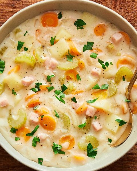 creamy potato and ham soup topped with chopped parsley