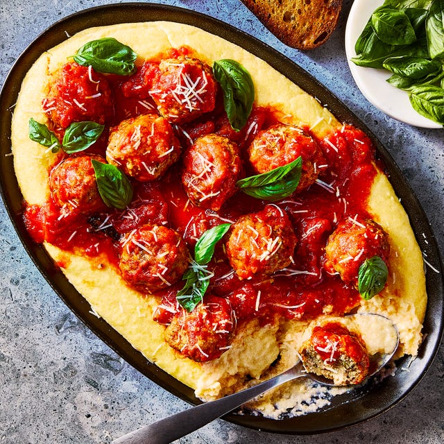 Creamy Polenta & Meatballs creamy polenta topped with meatballs in a red sauce