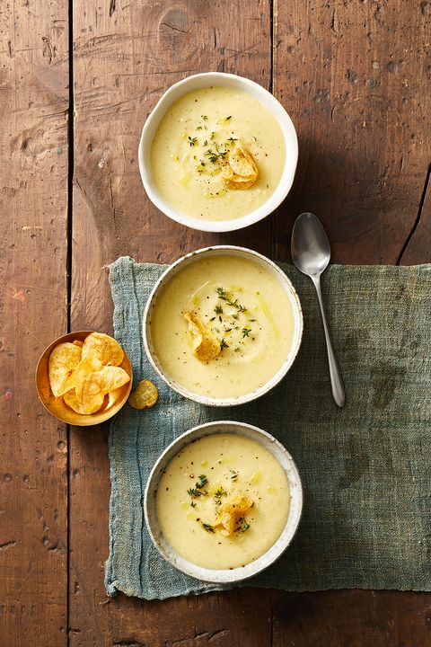 creamy potato soup in white bowls