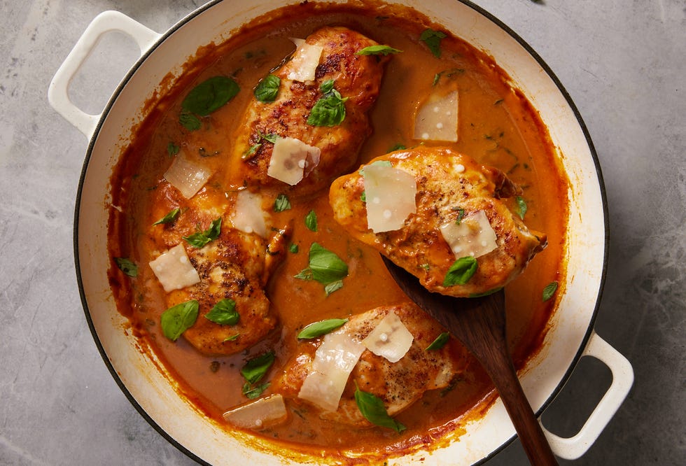 creamy pumpkin and parmesan chicken with linguine, topped with green onions
