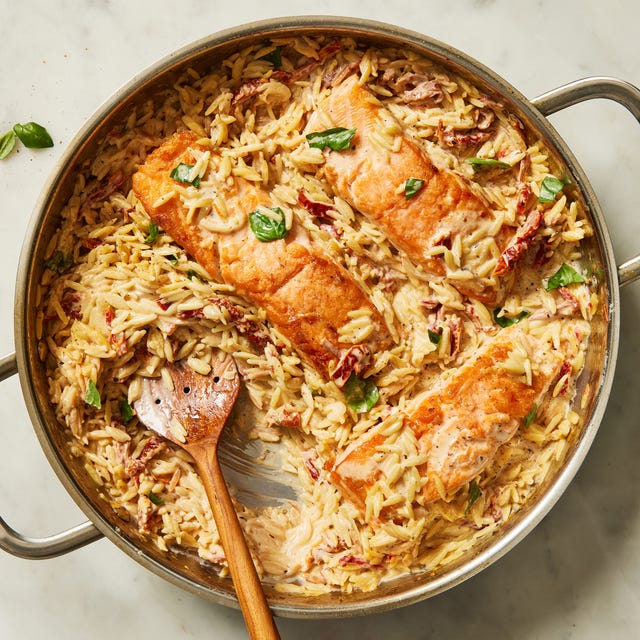 creamy sundried tomato salmon orzo topped with fresh basil