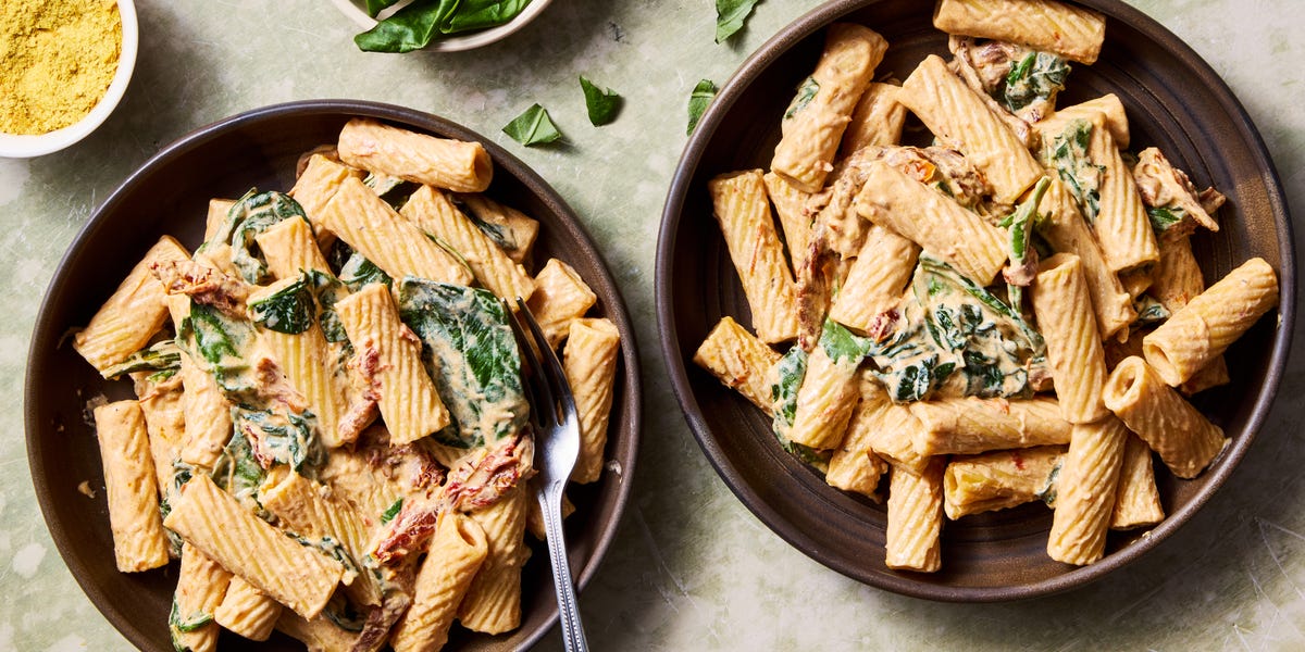 Creamy Tuscan Vegan Pasta rigatoni tossed in a creamy vegan tuscan sauce with spinach and sundried tomatoes