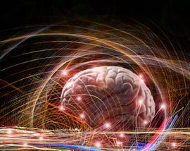 brain enveloped in complex light trails in an image about future brain research artificial intelligence and creativity