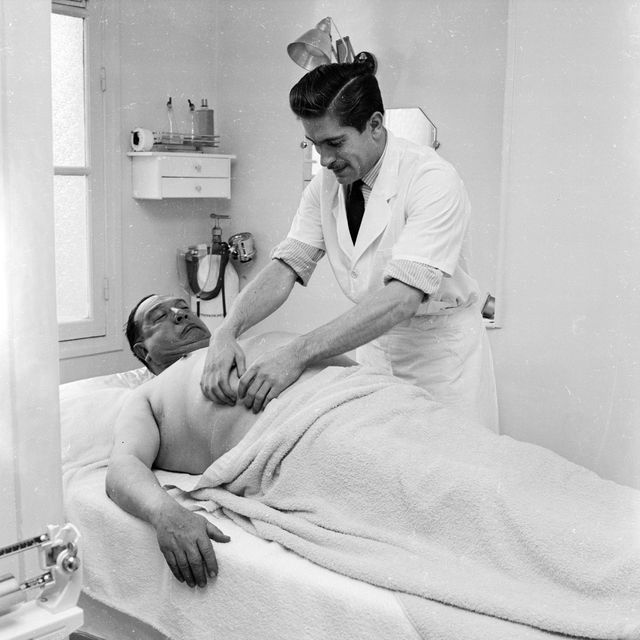 1955 french comic actor gabriello submits to a vigorous pummelling from a professional masseur during a monthly visit to the institute of masculine aesthetics in paris this beauty parlour for men already has a clientele of more than 200 photo by serge bertonbipsgetty images