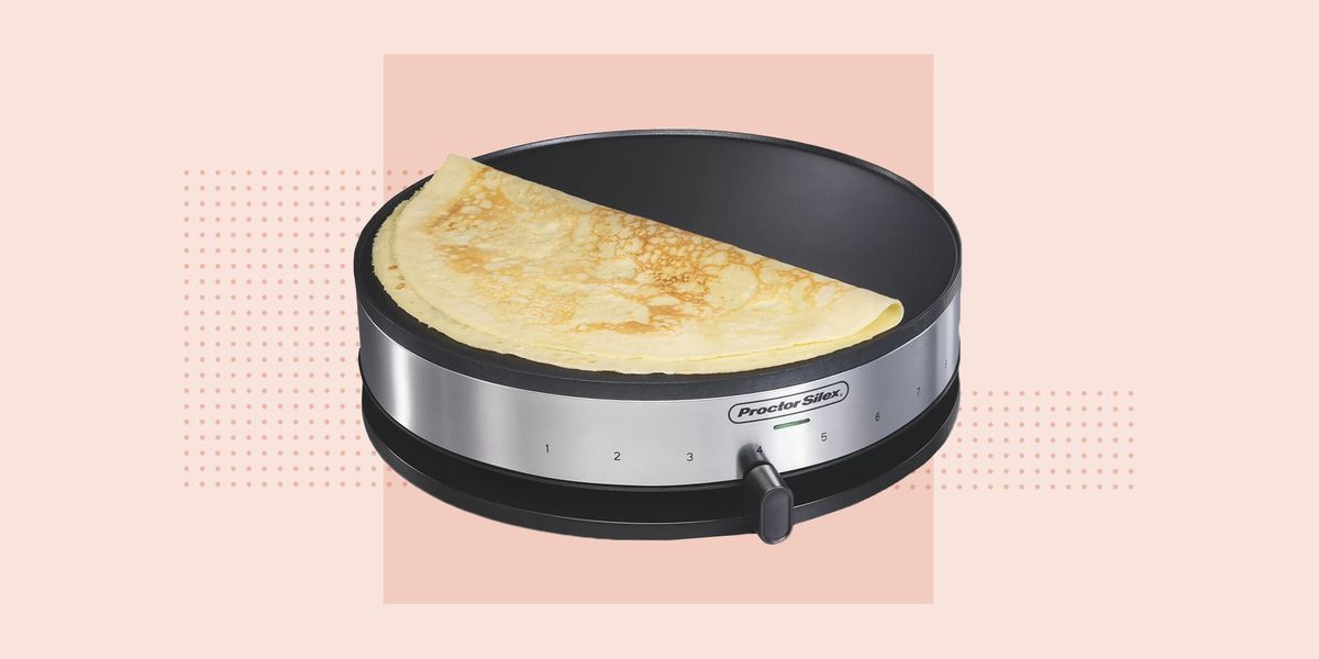 folded crepe cooking on top of crepe maker