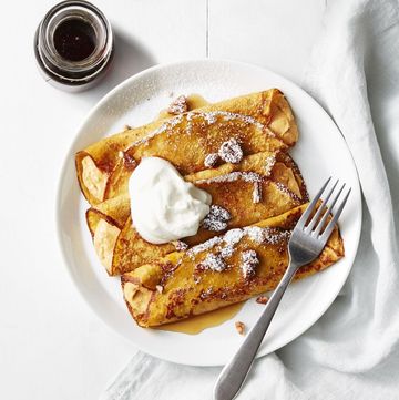 pumpkin cheesecake crepes on a white plate