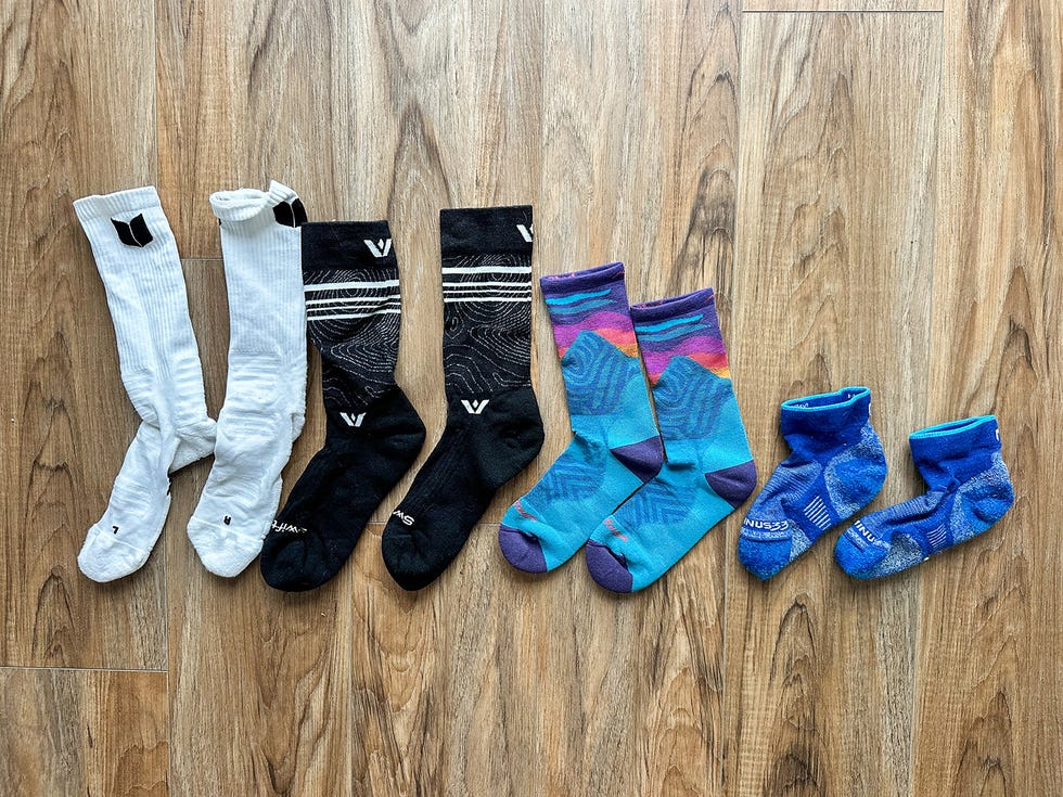various pairs of socks arranged in a row
