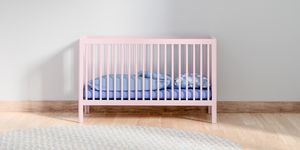 crib in bedroom at home