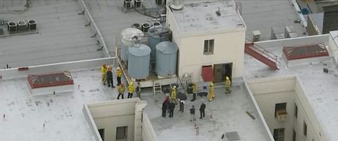 firefighters and police officers on the cecil hotel roof in episode 2 of crime scene the vanishing at the cecil hotel c courtesy of netflix © 2021