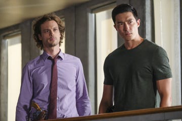 two characters from criminal minds stand next to each other