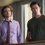 two characters from criminal minds stand next to each other