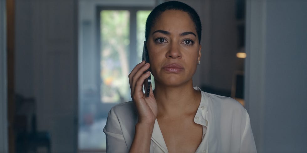 a person engaged in a phone call indoors