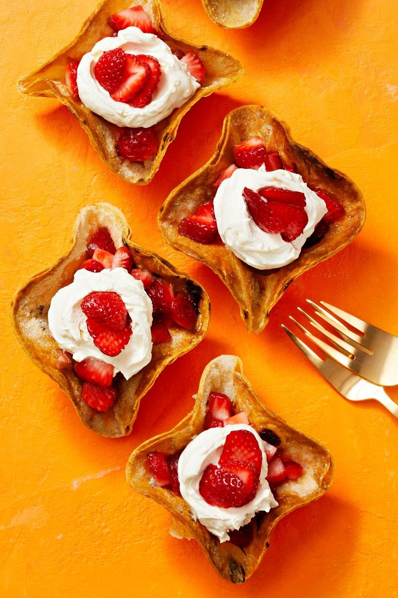 crispy tortilla bowls with strawberries and cream