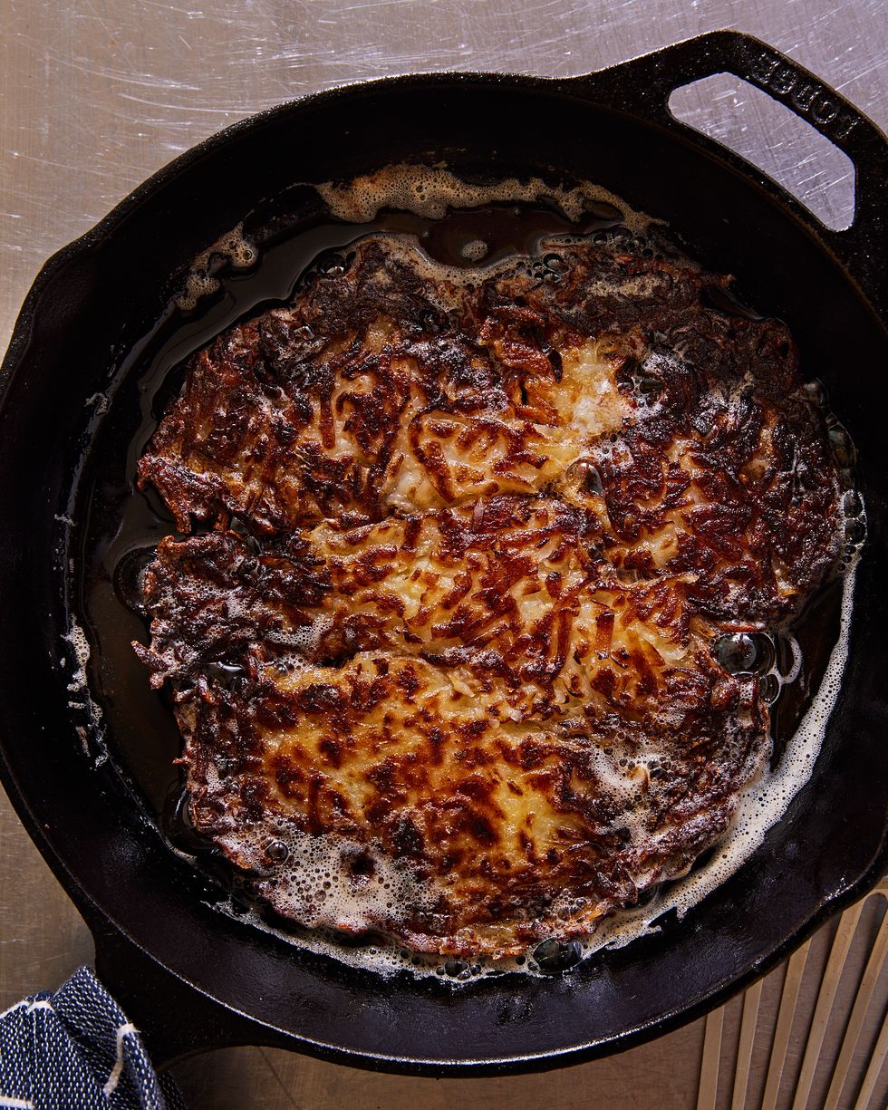 crispy hash browns in a black cast iron pan