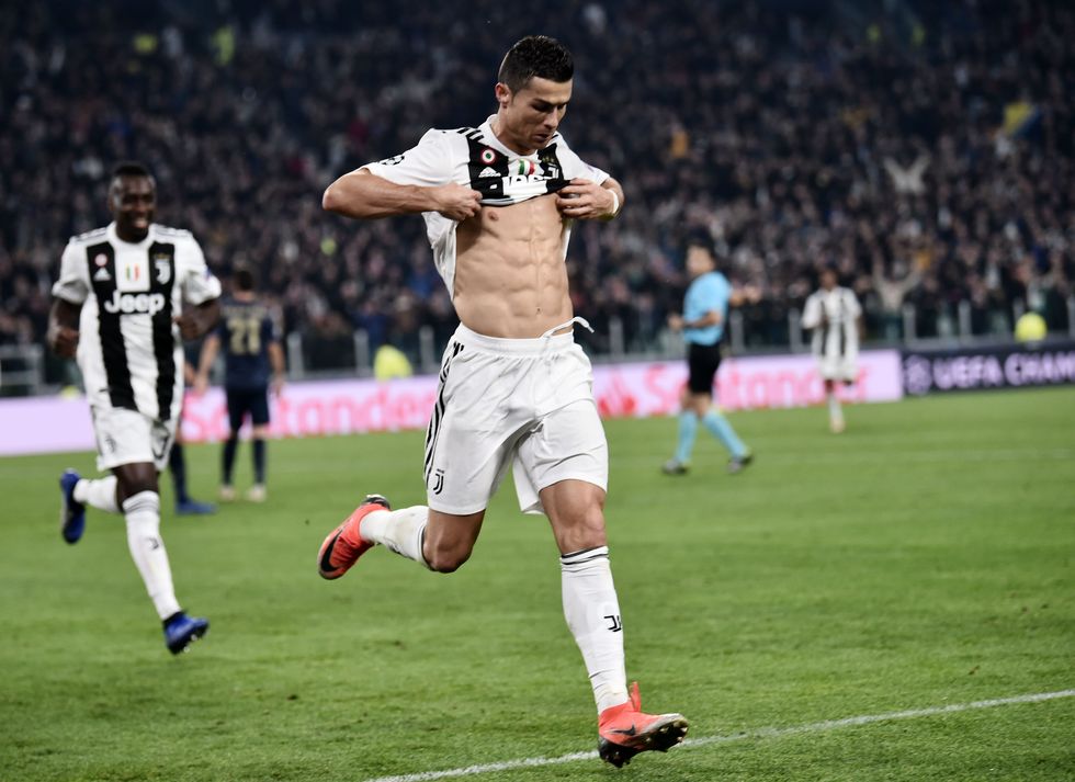 juventus portuguese forward cristiano ronaldo shows his six pack as he celebrates after opening the scoring during the uefa champions league group h football match juventus vs manchester united at the allianz stadium in turin on november 7, 2018 photo by marco bertorello  afp        photo credit should read marco bertorelloafp via getty images