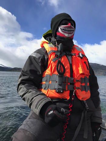 Lifejacket, Personal protective equipment, Recreation, Diving equipment, Dry suit, Geological phenomenon, Vehicle, Lifejacket, Jacket, 