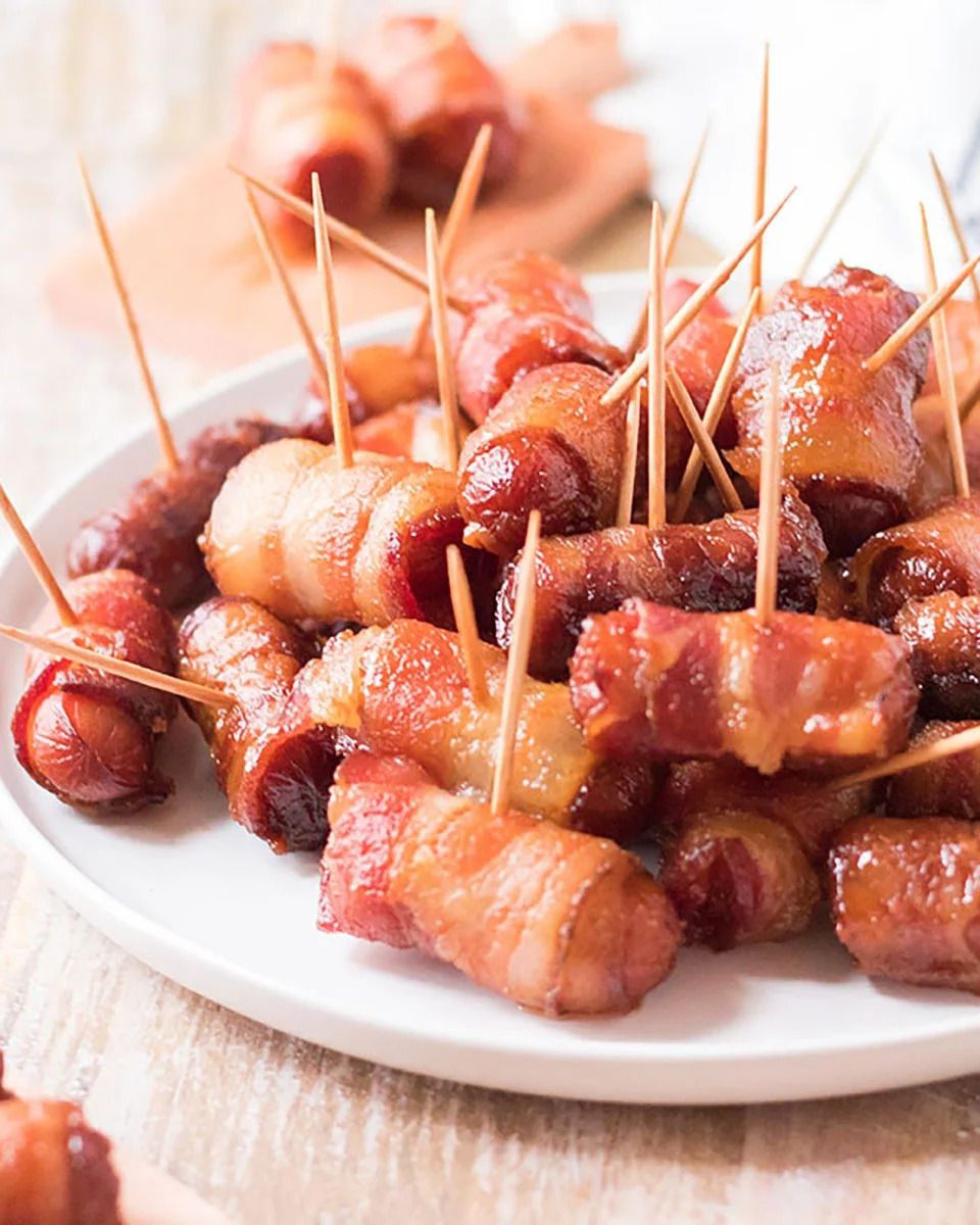 https://hips.hearstapps.com/hmg-prod/images/crock-pot-appetizers-slow-cooker-bacon-wrapped-smokies-1670439832.jpeg?crop=0.8xw:1xh;center,top&resize=980:*