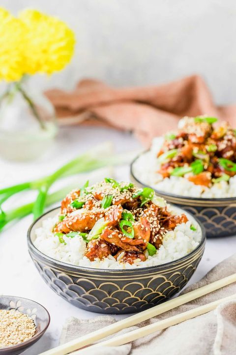 crockpot honey sesame chicken in bowl with rice