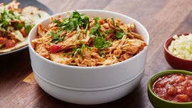 salsa chicken in a bowl topped with cilantro