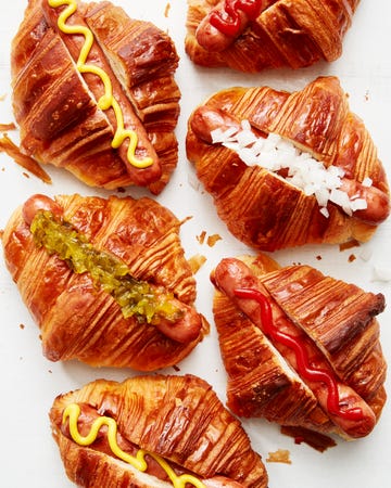 hot dogs in croissants with toppings