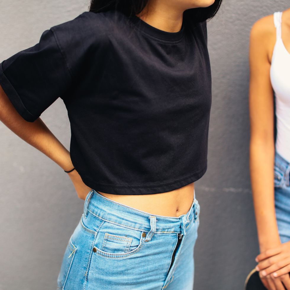 crop of teenage girls wearing jeans