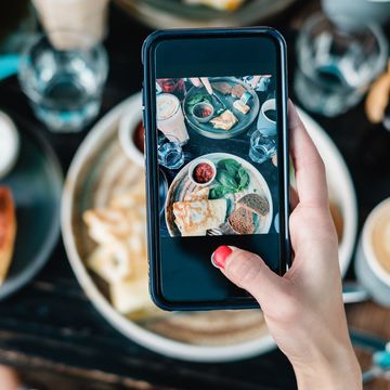 Cropped Hand Photographing Food With Smart Phone