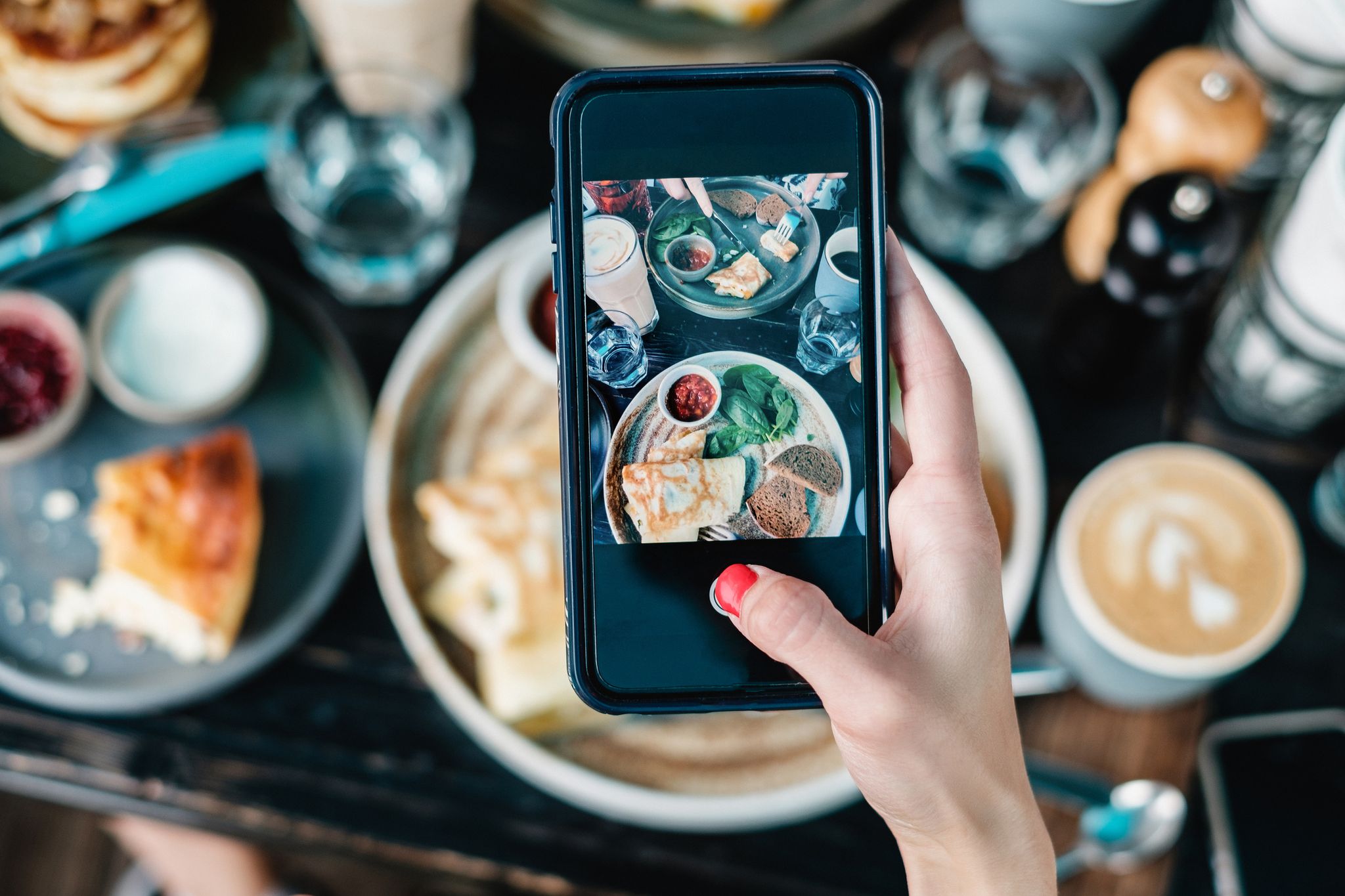 Cropped Hand Photographing Food With Smart Phone