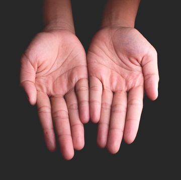 Cropped Hands Against Black Background