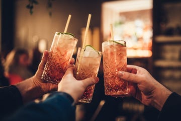 cropped hands of people holding drinks