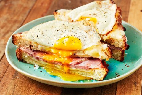 croque madame sandwich topped with an egg
