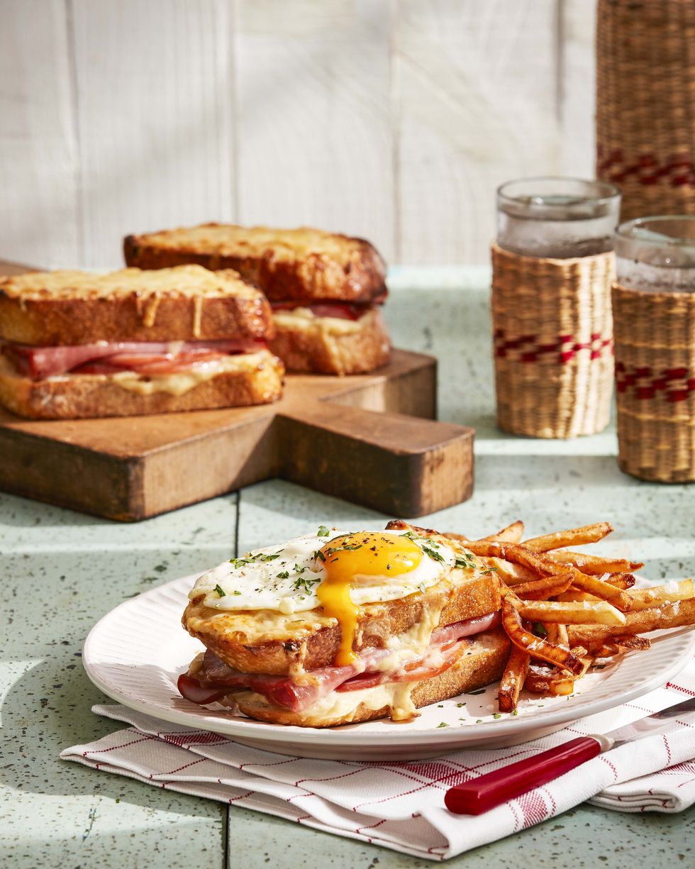 croque madame sandwich on plate with fries