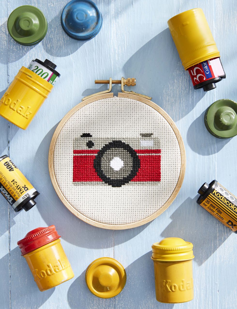 cross-stitch camera with vintage film containers