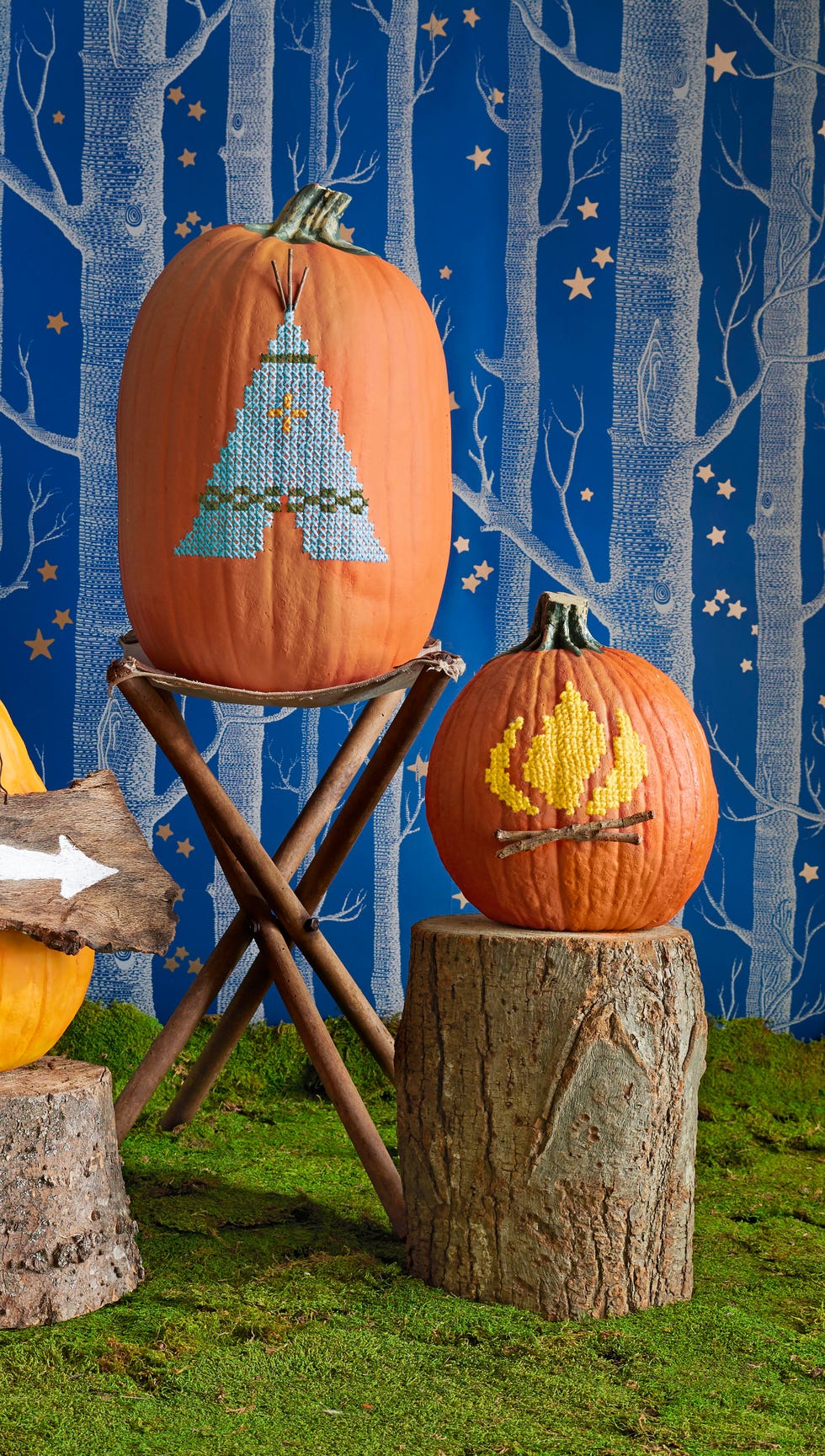 cross stitch pumpkin of a tent and campfire