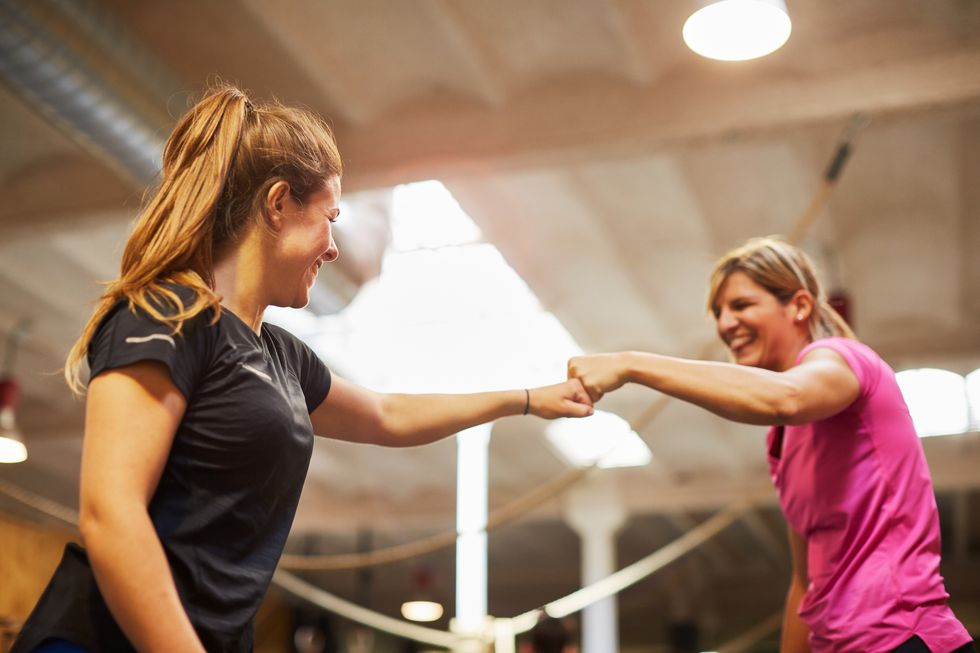 women celebrating at a gym