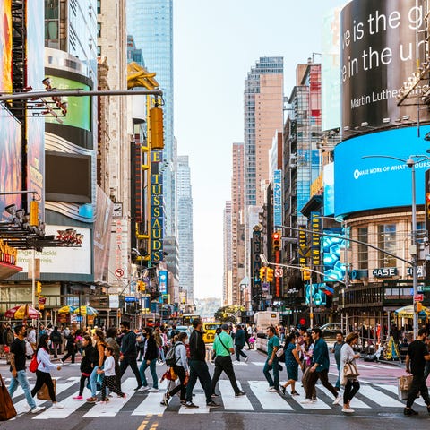 crowds of people on the streets of new york city, usa