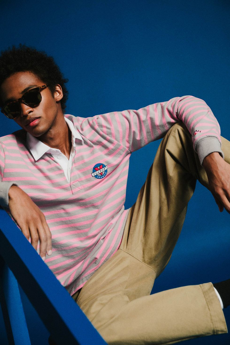 a campaign shot featuring sunglasses and a rugby shirt from noah's collaboration with vuarnet
