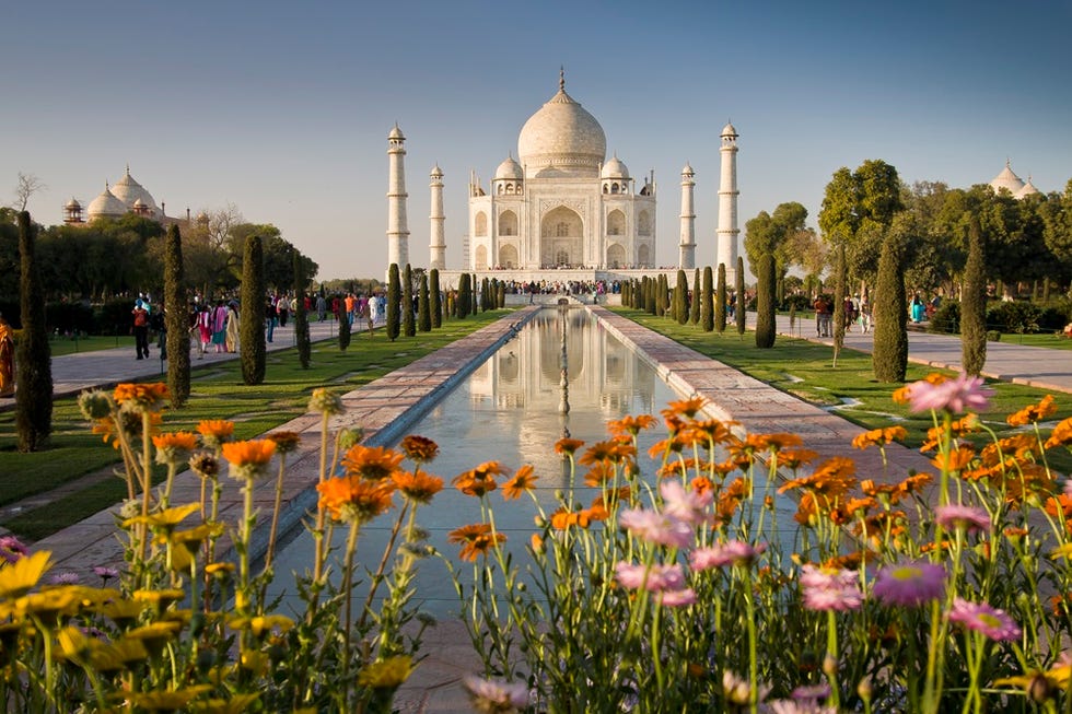 iconic mausoleum surrounded by gardens and tourists