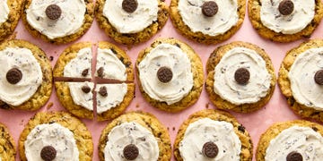 cookie topped with white icing and a mini oreo