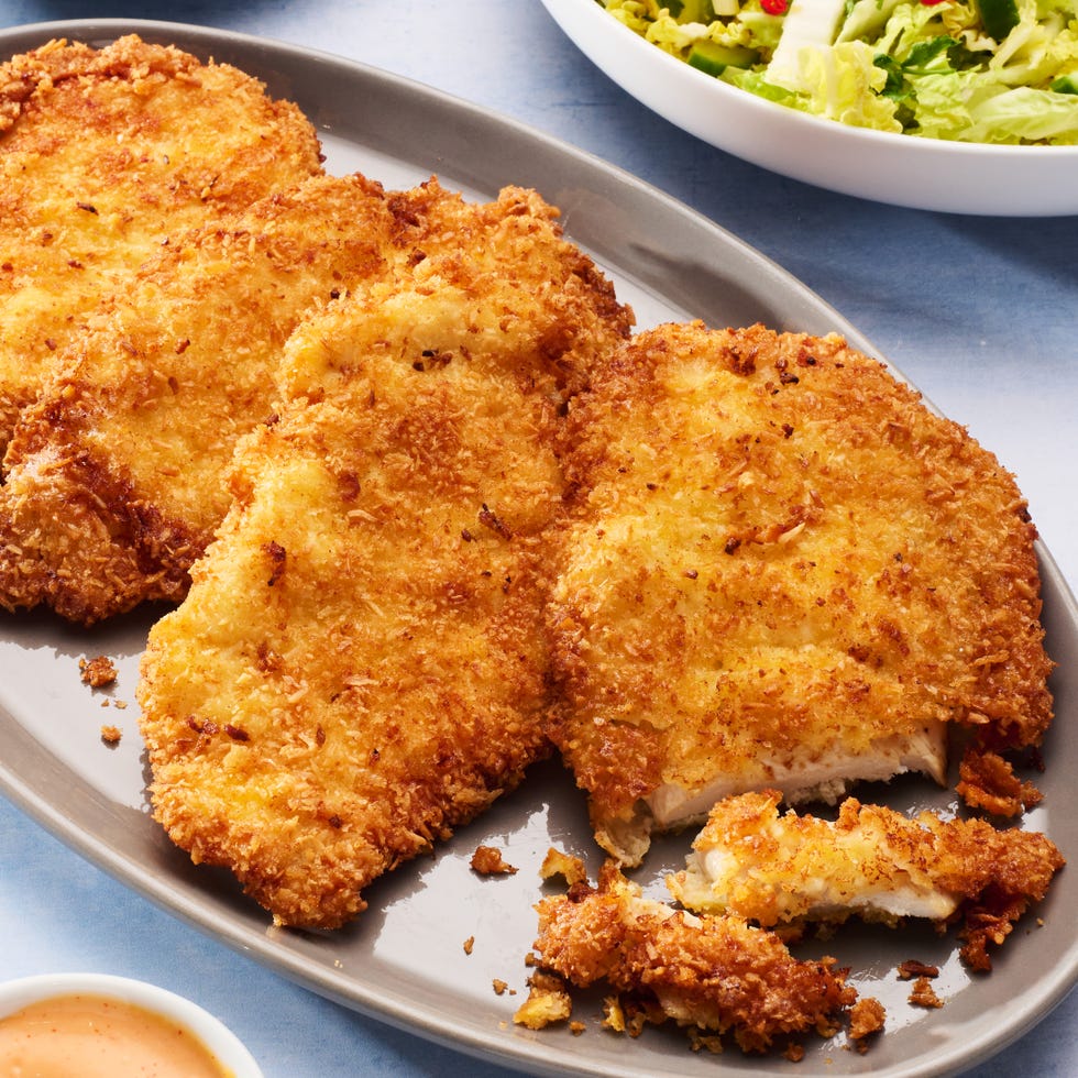chicken breasts coated in coconut and fried until crispy